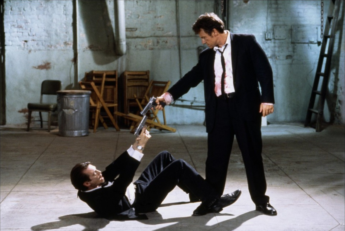 Mr. Pink (Steve Buscemi) and Mr. White (Harvey Keitel) face off in Reservoir Dogs (1992)